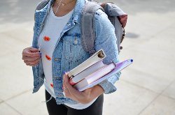 child holding books